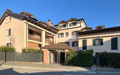 TRILOCALE CON DOPPIO GIARDINO, CANTINA E BOX AUTO