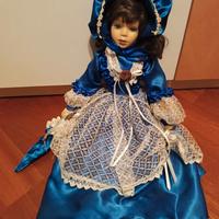 Bambola in ceramica vestito blu