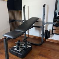 Panca regolabile con manubri e pesi