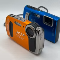 2 Fotocamere Fujifilm + Olympus – NON TESTATE