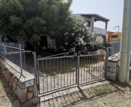 Casa con giardino