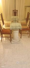 Tavolo in vetro  con colonne in pietra e 6 sedie