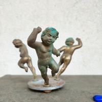 scultura antica di 3 putti