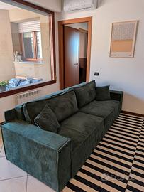 Divano letto in velluto verde a costine