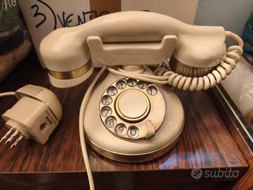 Telefono vintage a disco avorio e oro