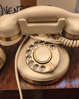 Telefono vintage a disco avorio e oro