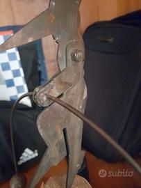 scultura ferro rame equilibrista pinocchio 