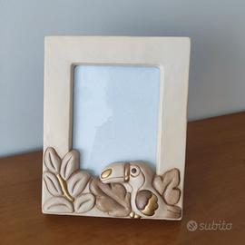 CORNICE PORTAFOTO "TUCANO" THUN