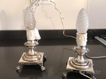 Coppia di lampade d’epoca in argento 800.