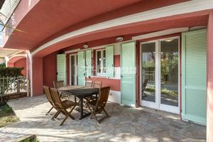 TRILOCALE CON GIARDINO E POSTO AUTO