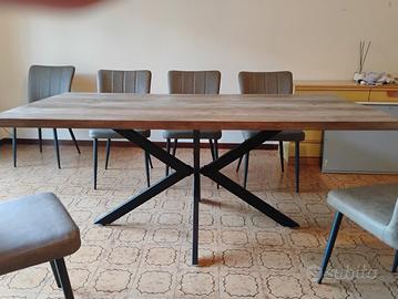 tavolo in legno con otto sedie in similpelle