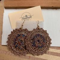 Orecchini in cotone laminato color bronzo €12