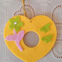 Cornice per foto in pannolencio a forma di cuore