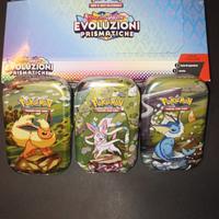 Pokémon, case 3 tin Evoluzioni Prismatiche SEALED 
