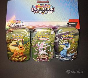 Pokémon, case 3 tin Evoluzioni Prismatiche SEALED 