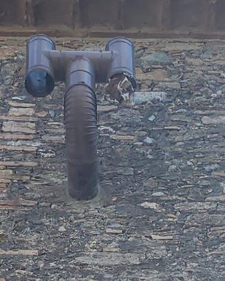 stufa a legno con i tubi