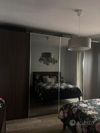 Armadio 4 ante scorrevoli con specchi centrali