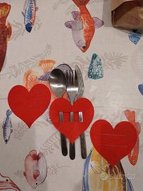 Tre porta posate a forma di cuore