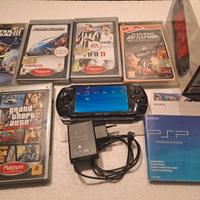 Psp con scatola e giochi