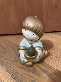 Porta camdela a forma di angioletto