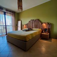 letto matrimoniale con contenitore + testiera