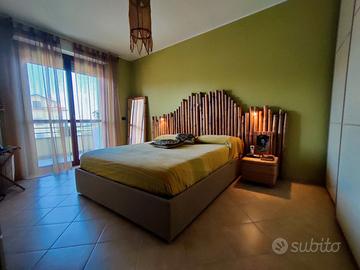 letto matrimoniale con contenitore + testiera