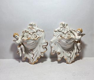 Coppia di acquasantiere da parete  ceramica putti