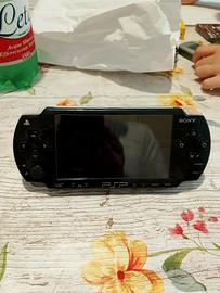 PlayStation portatile con disco da gioco  