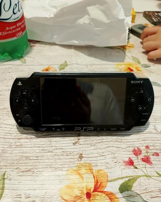 PlayStation portatile con disco da gioco  
