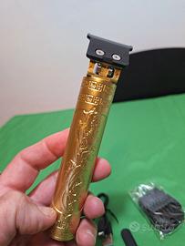 Rasoio per capelli elettrico dorato con incisioni