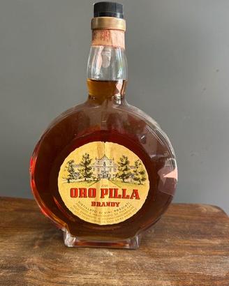 Bottiglia rara Orologio brandy ORO PILLA 1000CL.