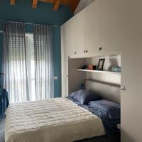 Armadio a ponte e letto matrimoniale contenitore