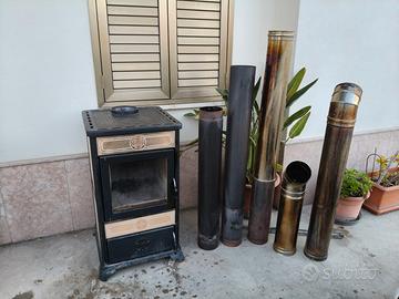 stufa a legna con tubi di collegamento 