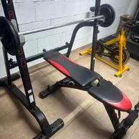 Palestra Domyos panca con rack, dischi, bilanciere