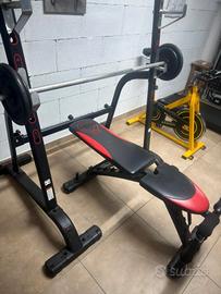 Palestra Domyos panca con rack, dischi, bilanciere