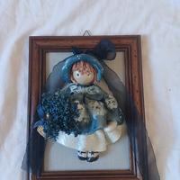 quadretto  con bambolina  in ceramica  