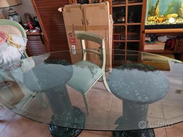 TAVOLO ELLITTICO IN CRISTALLO CON COLONNE IN MARMO