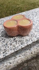 Candela citronella in vasetto di terracotta