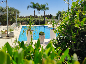 Camere in villa con piscina