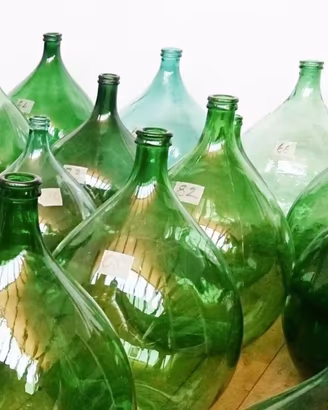 Damigiana di vetro verde impagliata vintage 54 lit