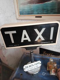 insegna Taxi con staffa