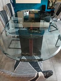Tavolo di cristallo con basi in marmo....top