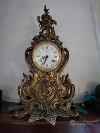 orologio e due candelabri