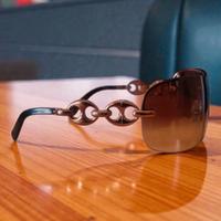 Occhiali da sole sfumati senza montatura Gucci 