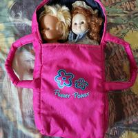 Porta bambole con due bambole.