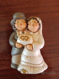 THUN sposi con cuscino e fedi nuziali