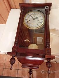 orologio a pendolo ricarica manuale