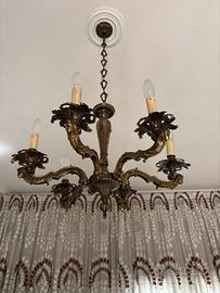 Lampadario a sei luci in ottone con mascheroni