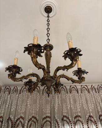 Lampadario a sei luci in ottone con mascheroni
