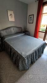 Letto matrimoniale imbottito con testata